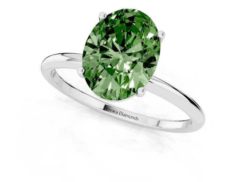 Fancy Green Oval Cut Diamond Solitaire Engagement Ring Set in Platinum with Thin Band and Prong Setting