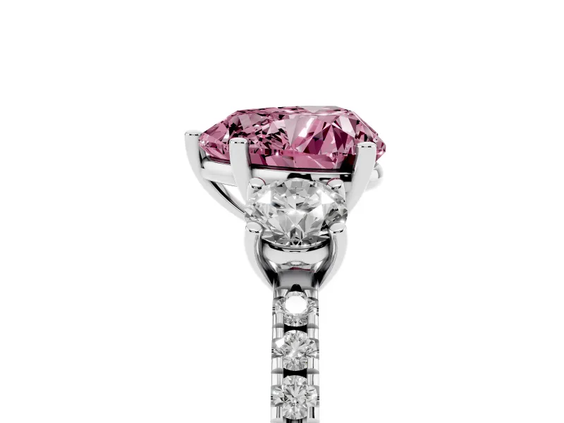 Fancy Pink Heart Cut Diamond Three-Stone Ring Set in Platinum with Pavé Band and Graduated Sides
