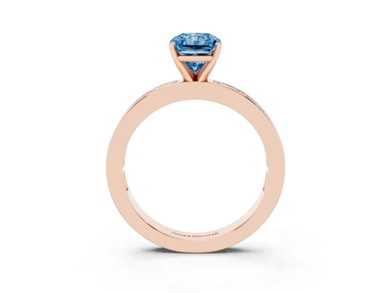 Fancy Blue Radiant Cut Diamond Solitaire Ring Set in Rose gold with Channel-Set Baguette Band and Prong Setting