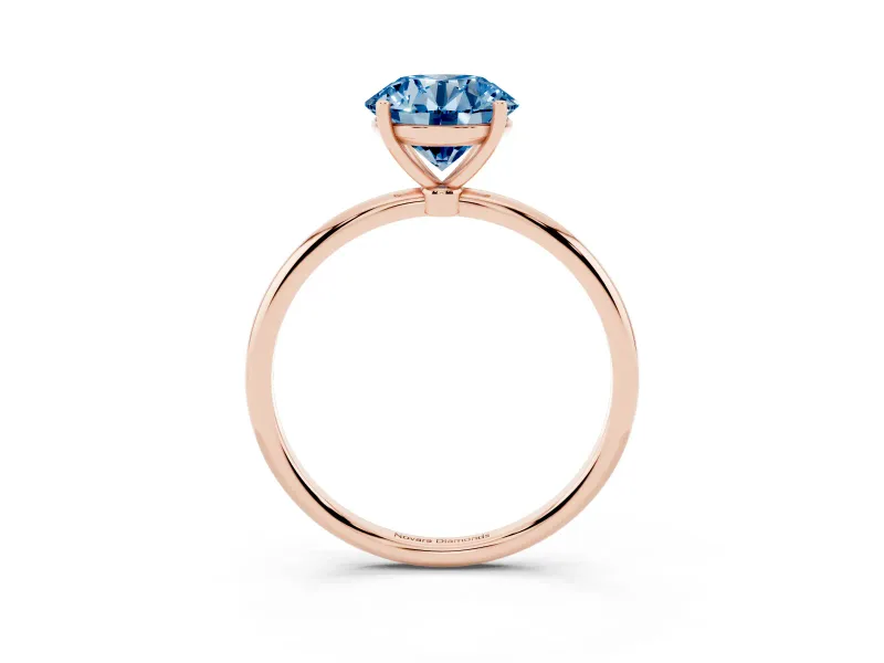 Fancy Blue Round Cut Diamond Solitaire Engagement Ring Set in Rose gold with Thin Band and Prong Setting