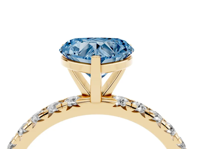 Fancy Blue Heart Cut Diamond Pavé Solitaire Ring Set in Yellow gold with Round Band and Prong Setting