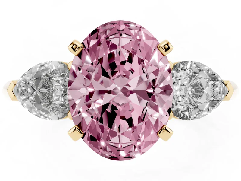 Fancy Pink Three-Stone Oval Cut Diamond Ring Set in Yellow gold with Pear Side Stones and Prong Setting