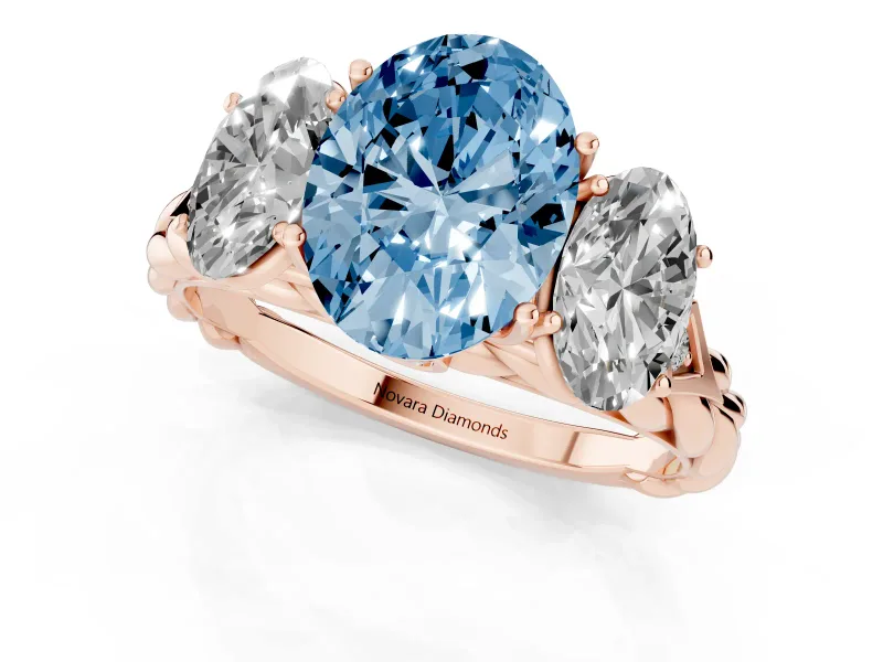 Fancy Blue Oval Cut Diamond Three-Stone Ring Set in Rose gold with Braided Band