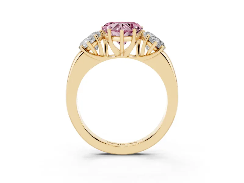 Fancy Pink Heart Cut Diamond Three-Stone Ring Set in Yellow gold with Bold Center and Classic Band