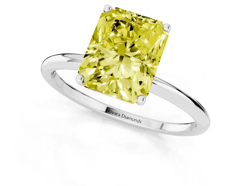 Fancy Yellow Radiant Cut Diamond Solitaire Engagement Ring Set in White gold with Thin Band and Prong Setting