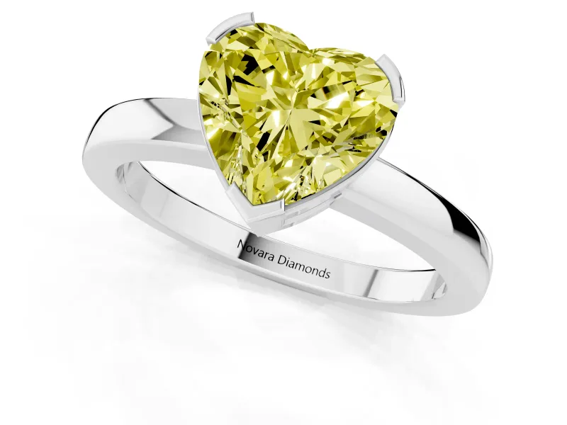 Fancy Yellow Heart Cut Diamond Solitaire Ring Set in White gold with Prong Head and Smooth Polished Band