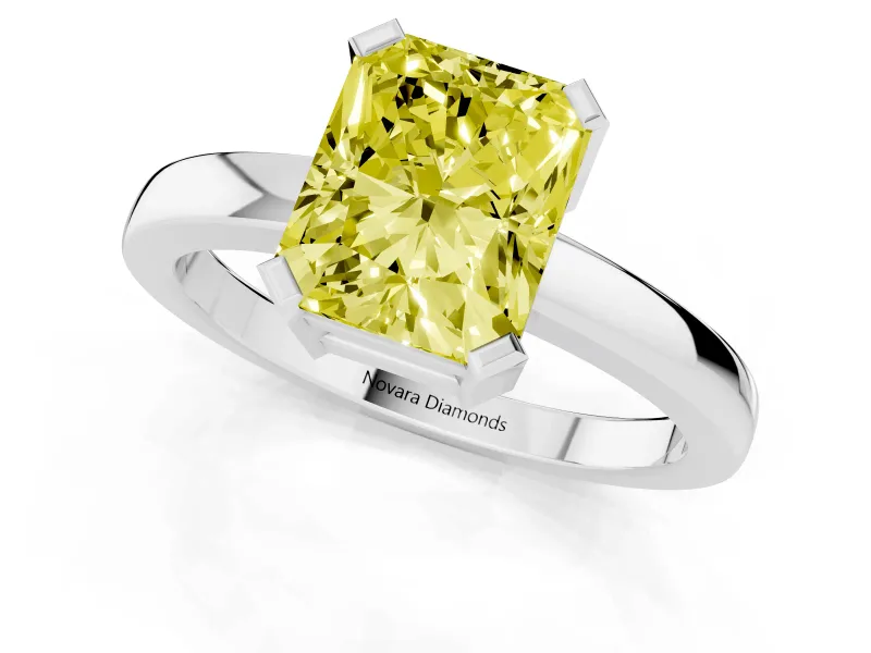 Fancy Yellow Radiant Cut Diamond Solitaire Ring Set in Silver with Prong Head and Smooth Polished Band
