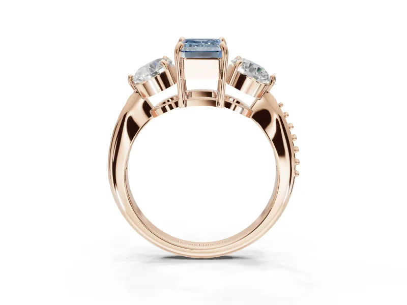 Emerald Cut Three Stone Engagement Ring Setting for a Fancy Blue Lab-Grown Diamond | Tapered Pave Band | Rose Gold