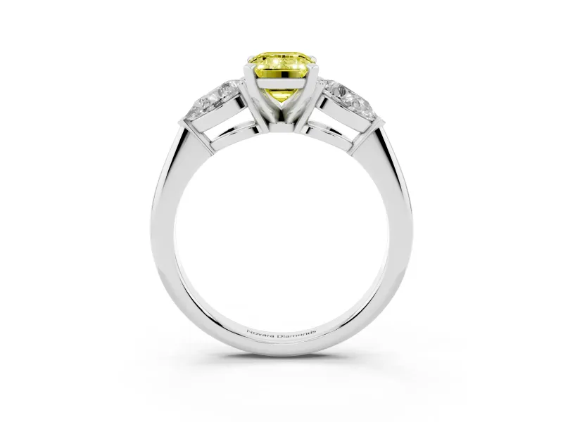 Fancy Yellow Three-Stone Emerald Cut Diamond Ring Set in Platinum with Pear Side Stones and Prong Setting