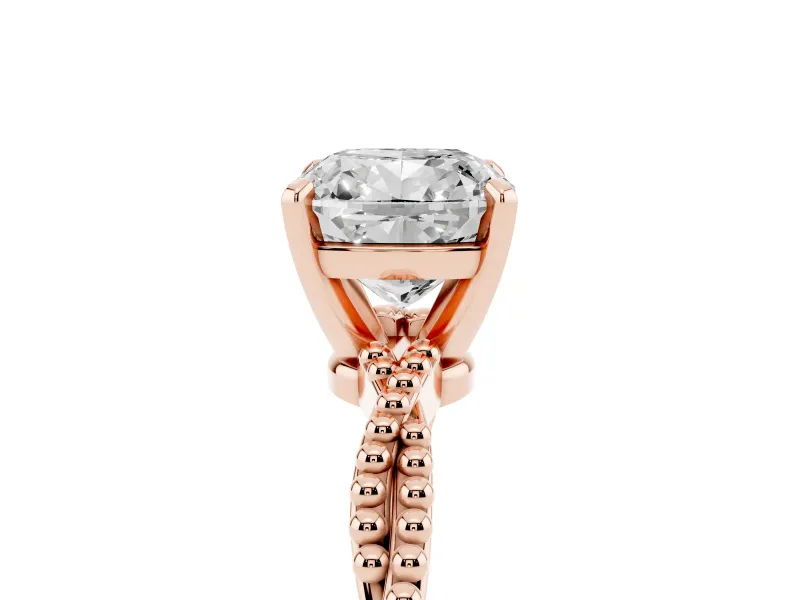 Cushion Cut Diamond Solitaire Ring Set in Rose gold with Twisted Band and Bead Prong Setting