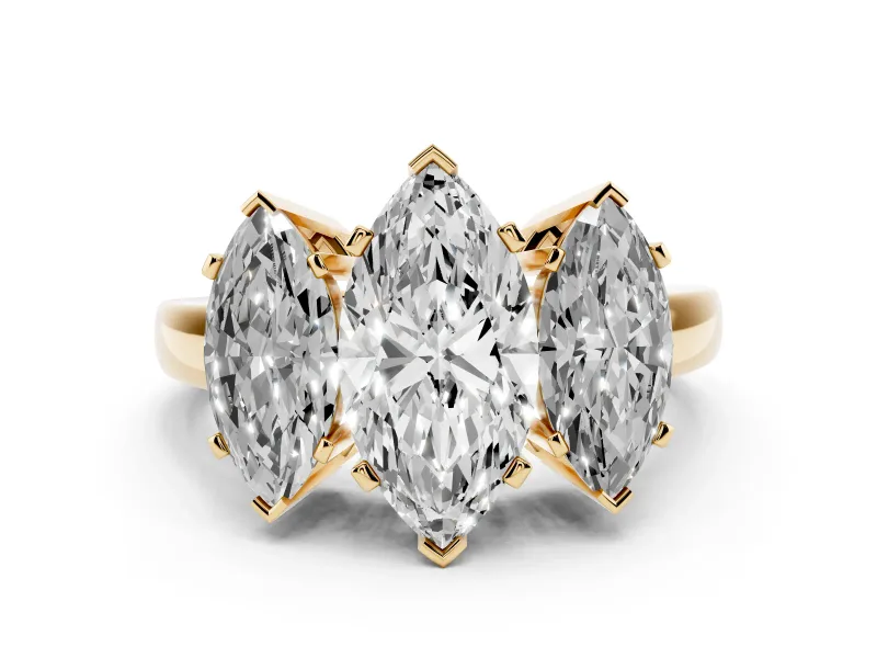 Marquise Cut Diamond Three-Stone Ring Set in Yellow gold with Channel-Set Band and Prong Settings