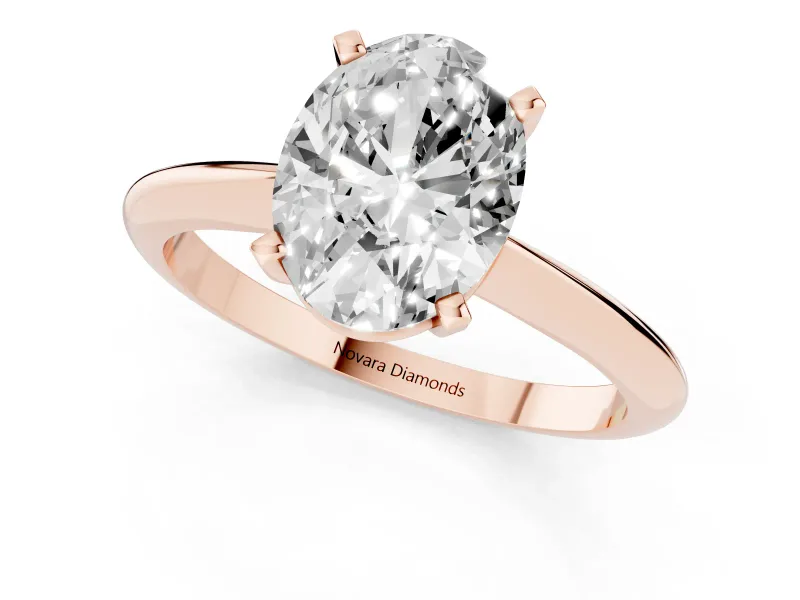 Oval Cut Diamond Solitaire Ring Set in Rose gold with Prong Setting on a Plain Round Band