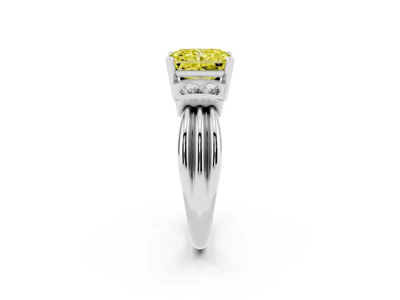 Fancy Yellow Three-Stone Radiant Cut Diamond Channel Set Ring Set in White gold with Bar Prongs