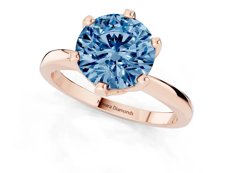 Fancy Blue Round Cut Diamond Solitaire Engagement Ring Set in Rose gold with Slim Tapered Solitaire Band