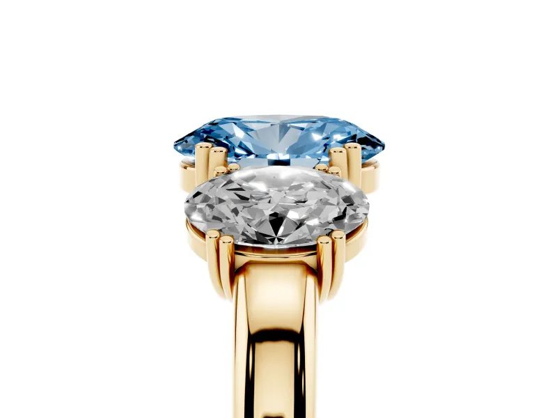 Fancy Blue Oval Cut Diamond Three-Stone Ring Set in Yellow gold with Polished Band and Prong Setting