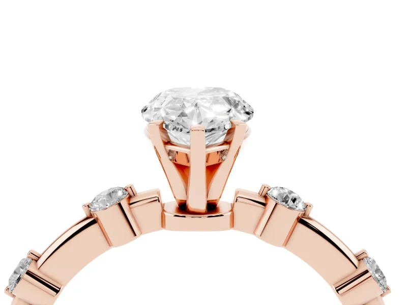 Pear Cut Diamond Solitaire Ring Set in Rose gold with Bezel Set Side Stones and Prong Setting