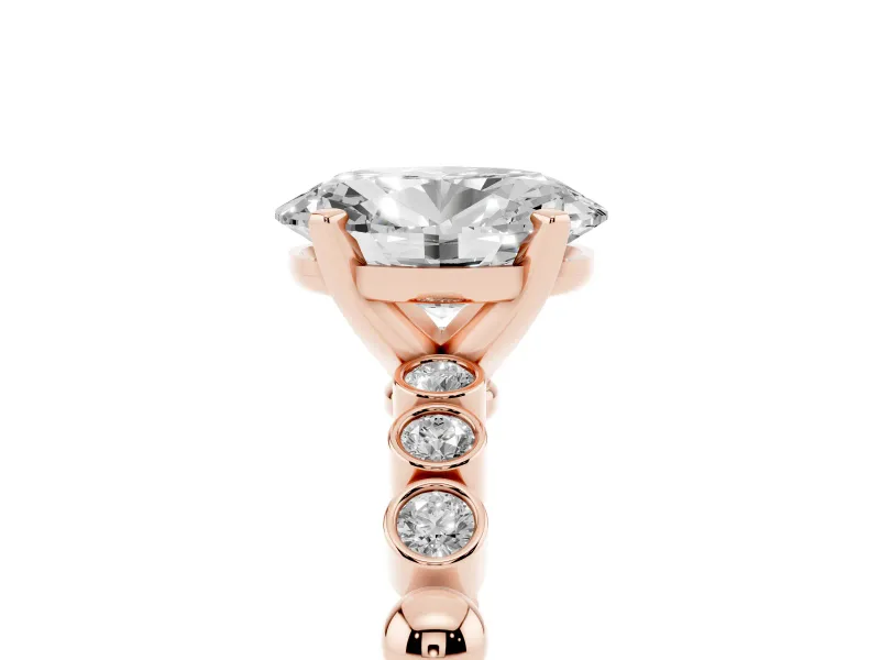 Oval Cut Diamond Solitaire Engagement Ring Set in Rose gold with Bezel Accents on Beaded Band
