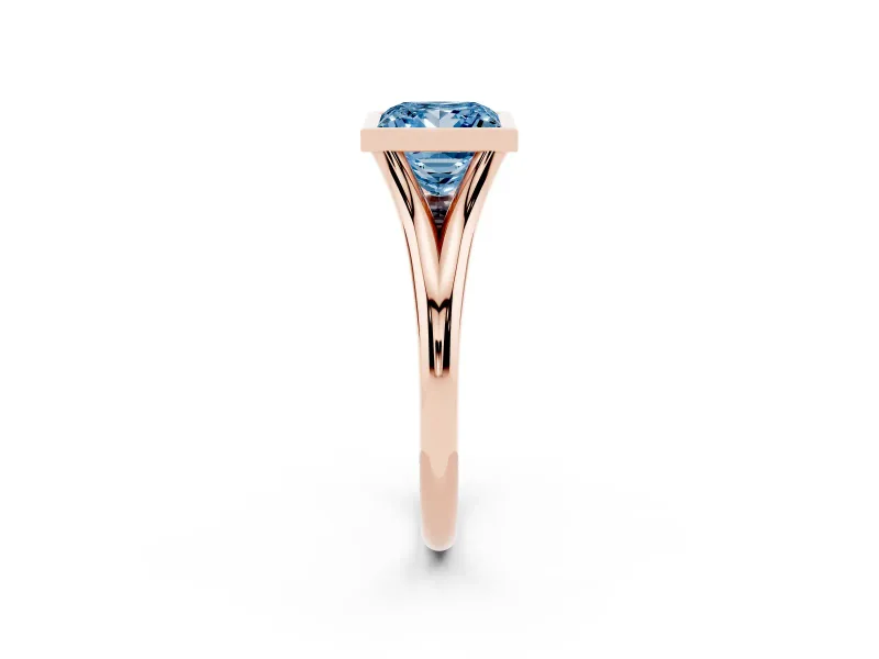 Fancy Blue Bezel Set Princess Cut Diamond Solitaire Ring Set in Rose gold with Tapered Band