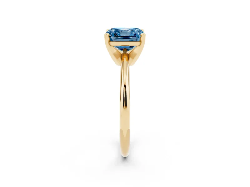 Fancy Blue Asscher Cut Diamond Solitaire Ring Set in Yellow gold with Prong Setting on a Plain Round Band