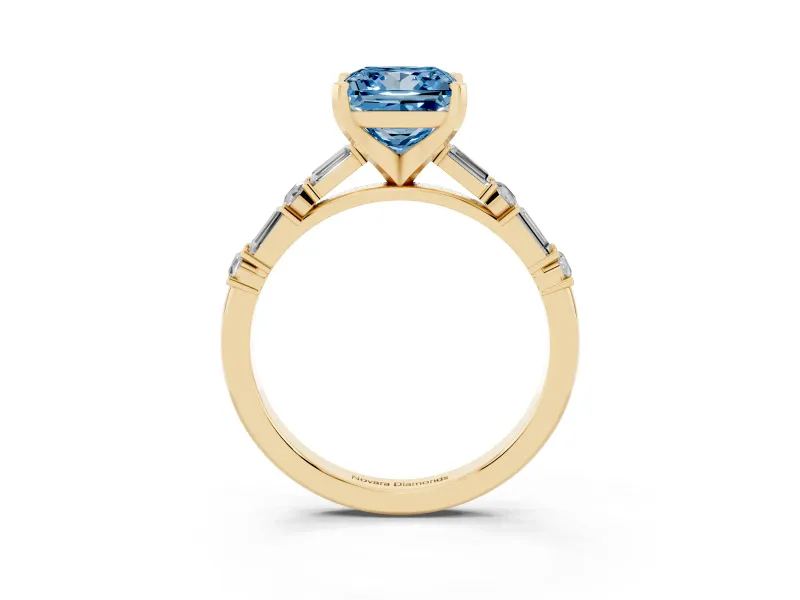 Fancy Blue Princess Cut Diamond Solitaire Set in Yellow gold with Side Baguettes and Channel Set Band