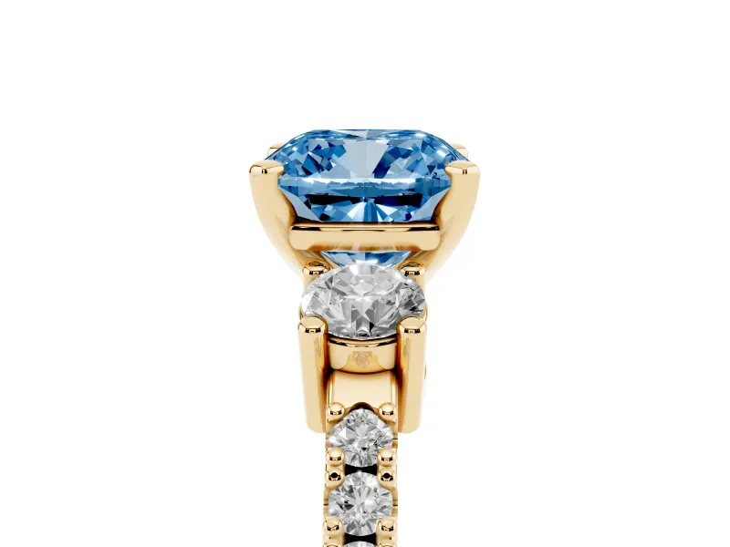 Fancy Blue Three-Stone Cushion Cut Diamond Pavé Band Ring Set in Yellow gold with Prong Setting