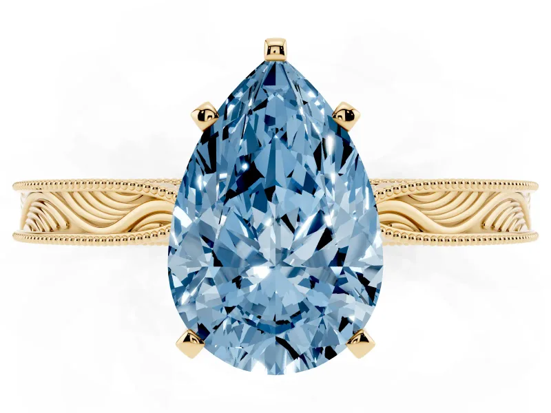 Fancy Blue Pear Cut Diamond Solitaire Milgrain Engraved Band Set in Yellow gold with Prong Setting