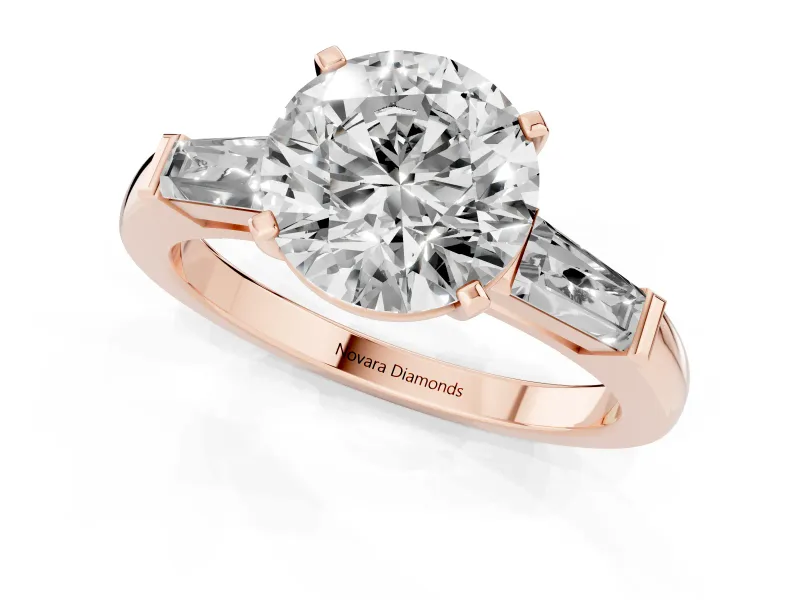 Round Cut Diamond Solitaire Ring Set in Rose gold with Tapered Baguette Side Stones and Prong Setting