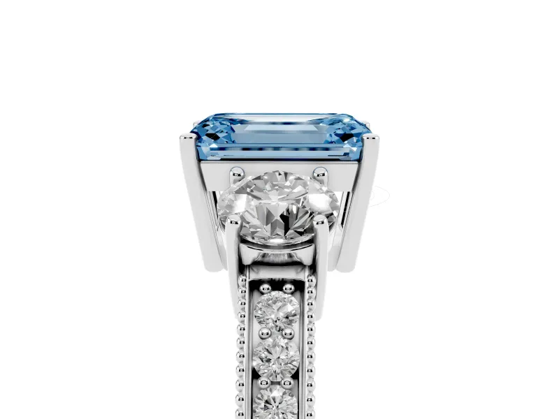 Fancy Blue Emerald Cut Diamond Three-Stone Ring Set in Platinum with Round Side Stones and Pavé Band