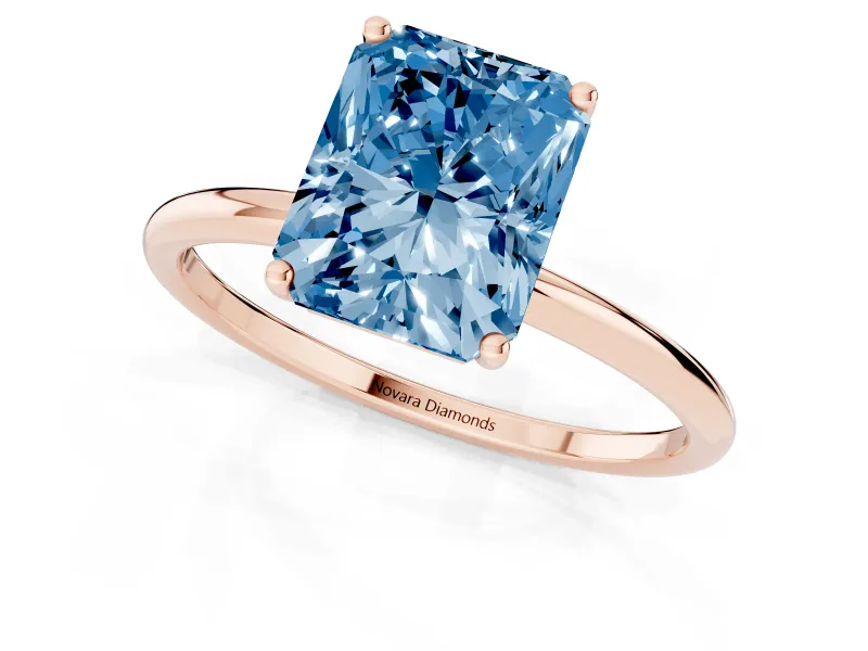 Fancy Blue Radiant Cut Diamond Solitaire Engagement Ring Set in Rose gold with Thin Band and Prong Setting