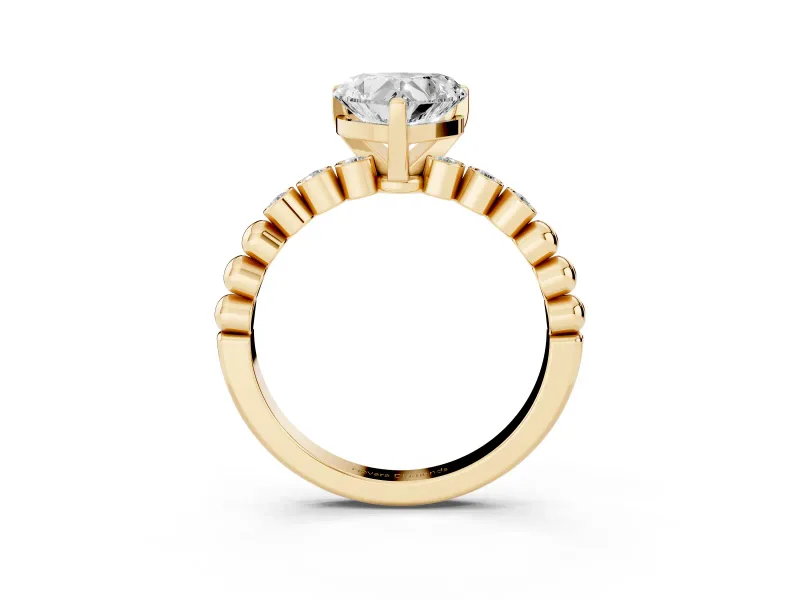 Heart Cut Diamond Solitaire Engagement Ring Set in Yellow gold with Bezel Accents on Beaded Band