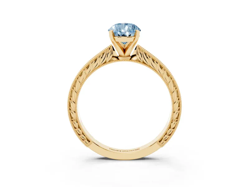 Fancy Blue Pear Cut Diamond Solitaire Milgrain Engraved Band Set in Yellow gold with Prong Setting