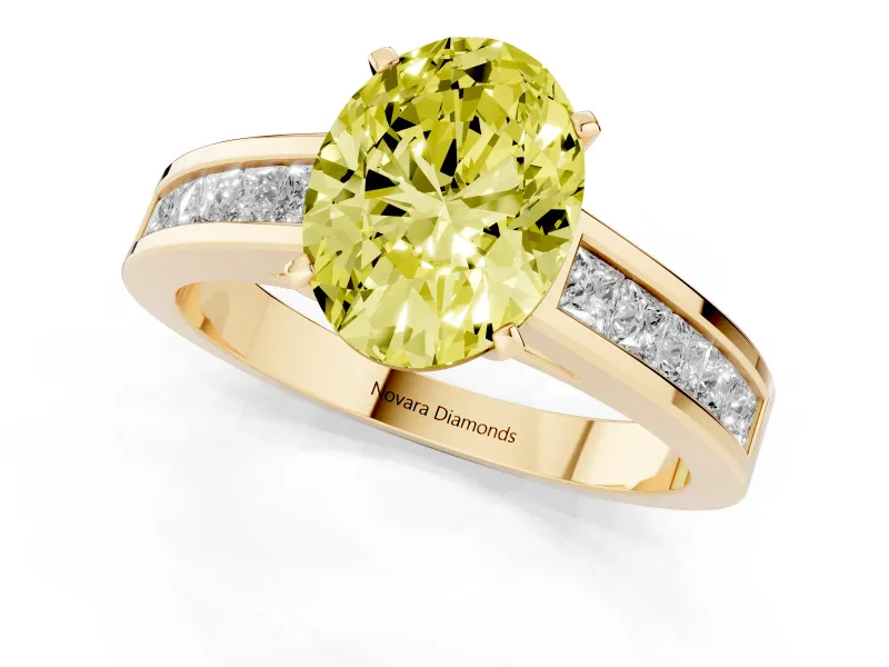 Fancy Yellow Oval Cut Diamond Solitaire Ring Set in Yellow gold with Channel-Set Band and Prong Setting