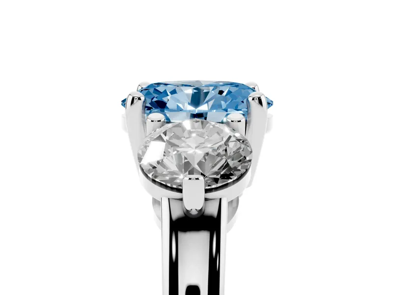 Fancy Blue Oval Cut Diamond Three-Stone Ring Set in Silver with Prong Setting and Classic Band