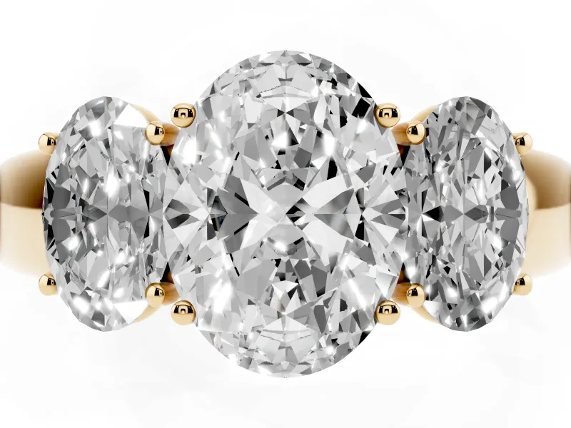 Three-Stone Oval Cut Diamond Ring Set in Yellow gold with Matching Prong Settings and Plain Band