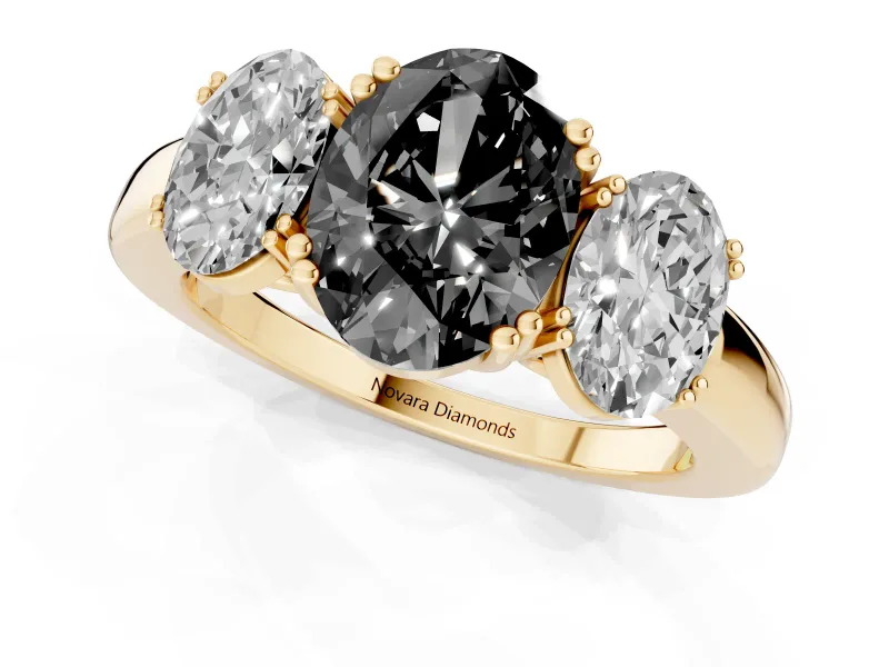 Fancy Black Oval Cut Diamond Three-Stone Ring Set in Yellow gold with Polished Band and Prong Setting