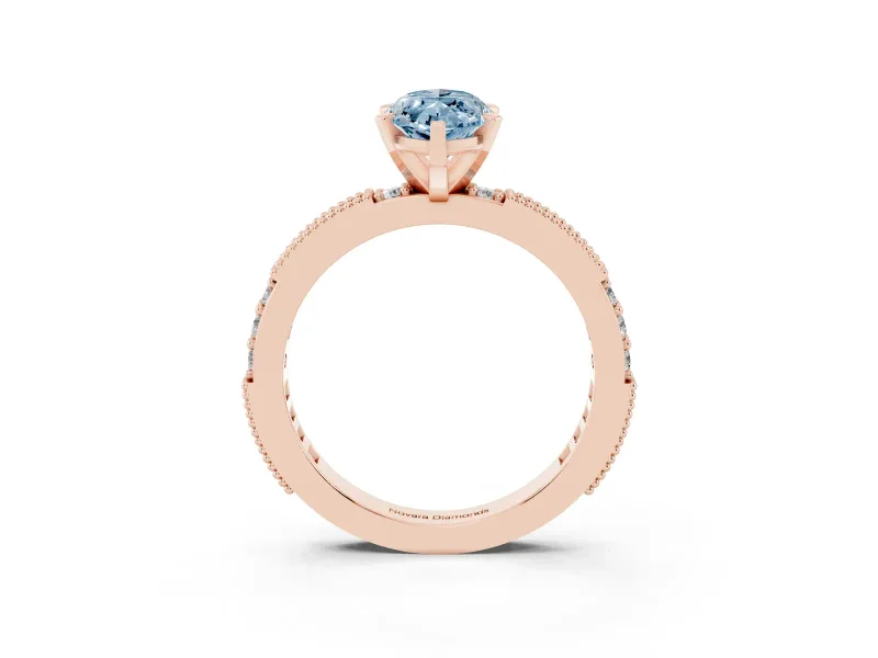 Fancy Blue Marquise Cut Diamond Solitaire Ring Set in Rose gold with Slim Pavé Band and Prong Setting