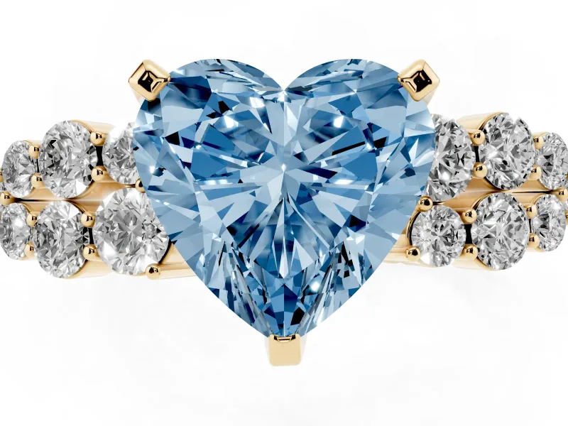 Fancy Blue Heart Cut Diamond Cluster Engagement Ring Set in Yellow gold with Pavé Band and Prong Setting