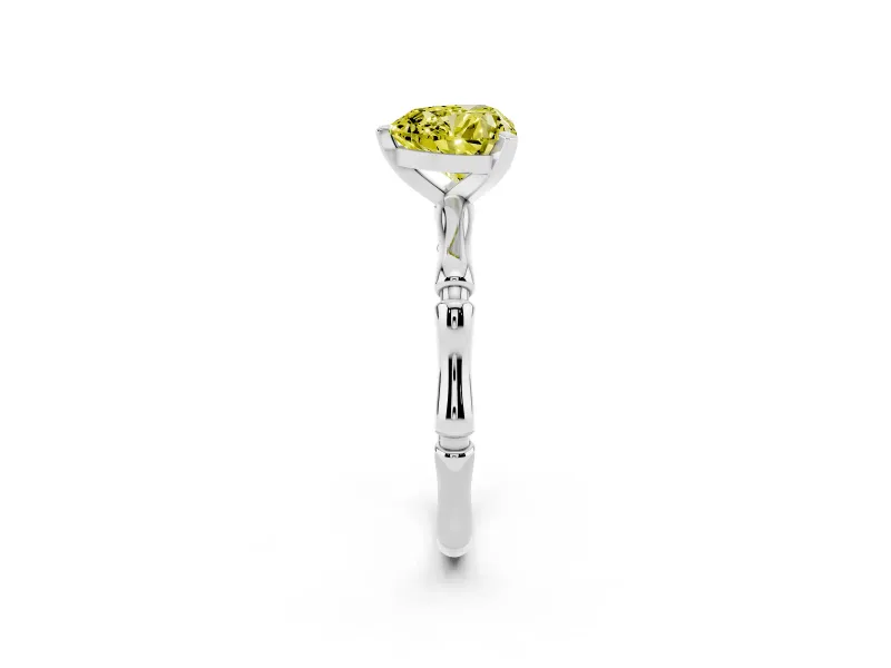 Fancy Yellow Heart Cut Diamond Solitaire Ring Set in Platinum with Bamboo Band and Prong Setting