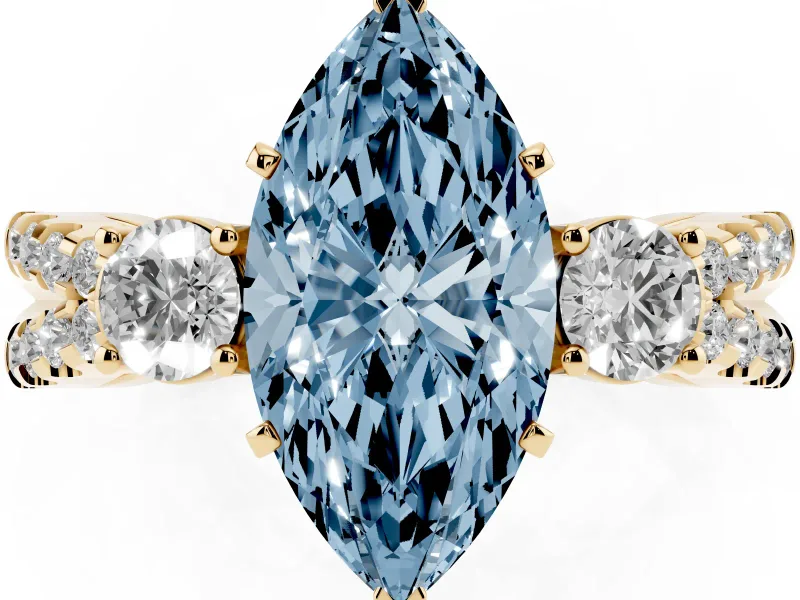 Fancy Blue Marquise Cut Diamond Three-Stone Ring Set in Yellow gold with Pavé Split Shank and Prong Setting