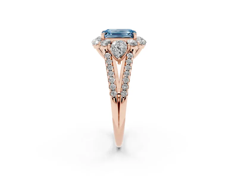 Fancy Blue Emerald Cut Diamond Halo Split Shank Engagement Ring Set in Rose gold with Prong-Held Center Stone