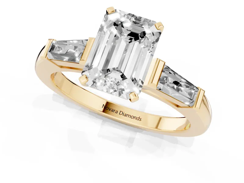 Emerald Cut Diamond Solitaire Ring Set in Yellow gold with Tapered Baguette Side Stones and Prong Setting