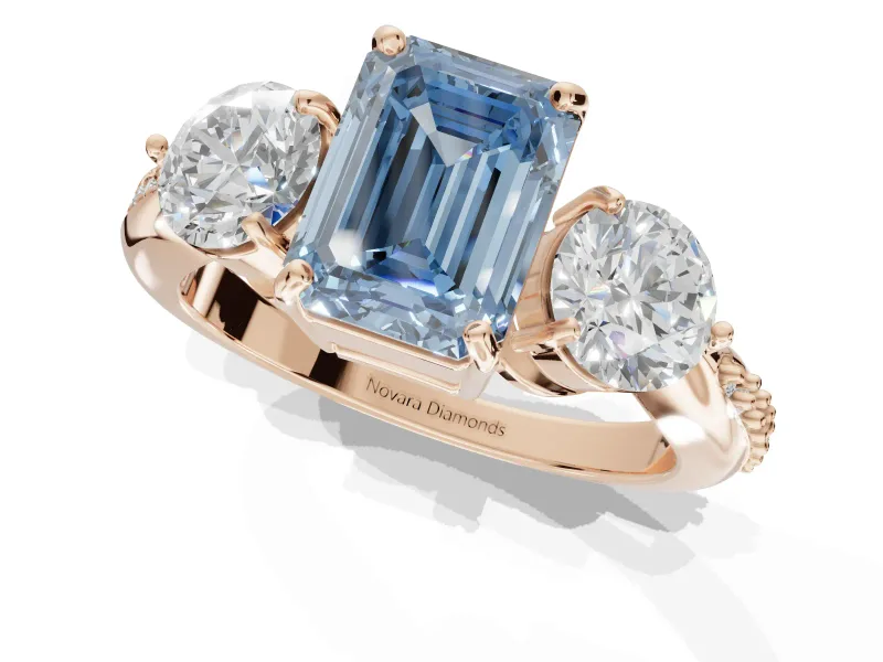 Emerald Cut Three Stone Engagement Ring Setting for a Fancy Blue Lab-Grown Diamond | Tapered Pave Band | Rose Gold