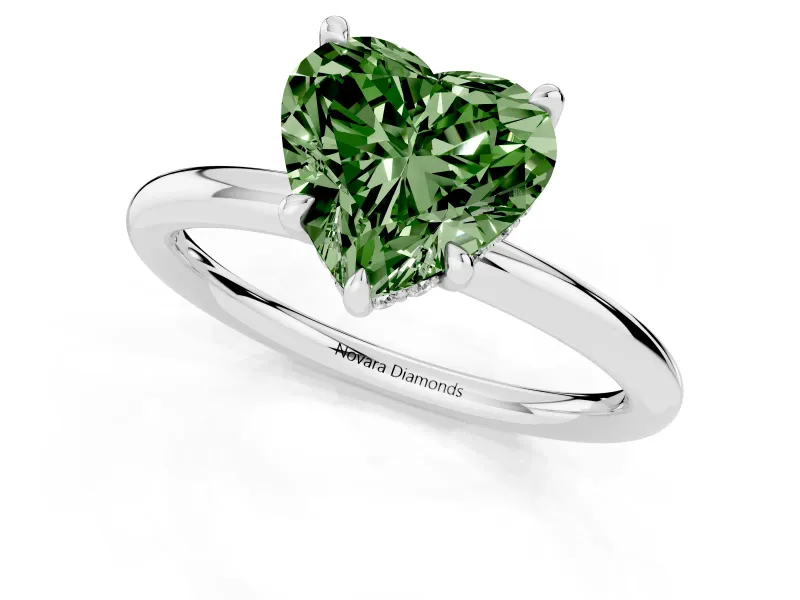 Fancy Green Heart Cut Diamond Solitaire Ring Set in Silver with Thin Band and Prong Setting