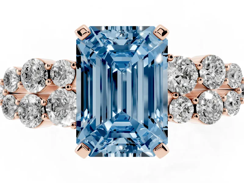 Fancy Blue Emerald Cut Diamond Cluster Engagement Ring Set in Rose gold with Pavé Band and Prong Setting