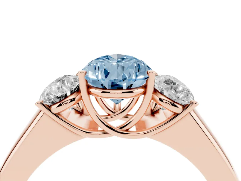 Fancy Blue Three-Stone Pear Cut Diamond Ring Set in Rose gold with Matching Prong Settings and Plain Band