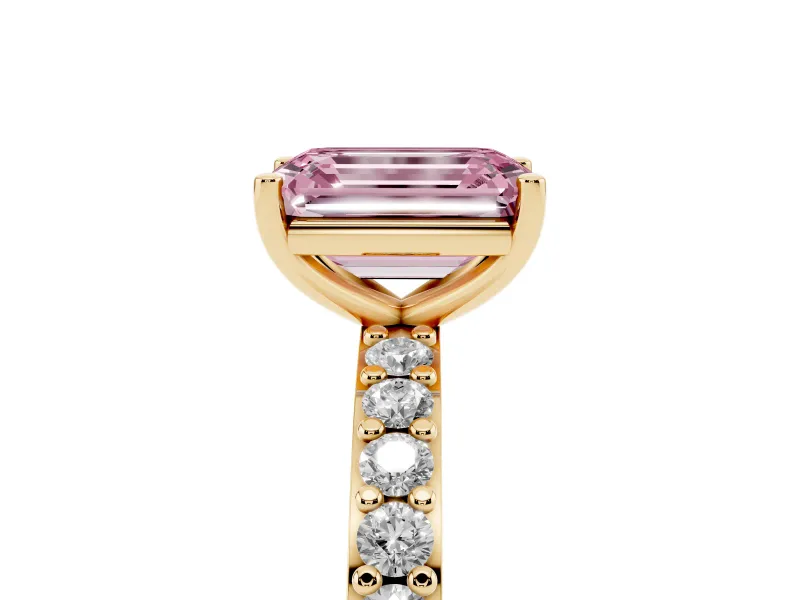 Fancy Pink Emerald Cut Diamond Solitaire Set in Yellow gold with Round Pavé Band and Prong Setting