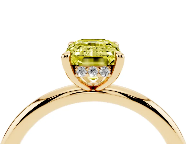 Fancy Yellow Emerald Cut Diamond Solitaire Ring Set in Yellow gold with Thin Band and Prong Setting