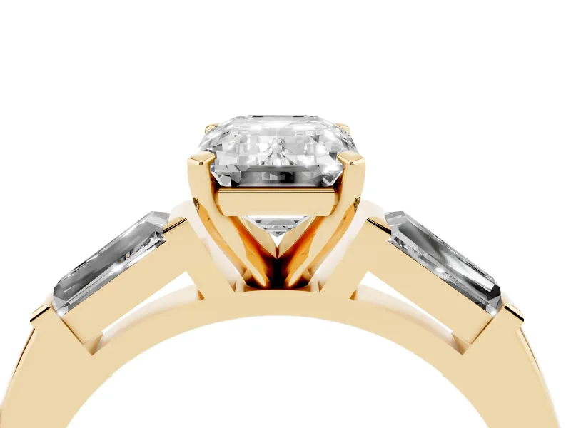 Emerald Cut Diamond Solitaire Ring Set in Yellow gold with Tapered Baguette Side Stones and Prong Setting
