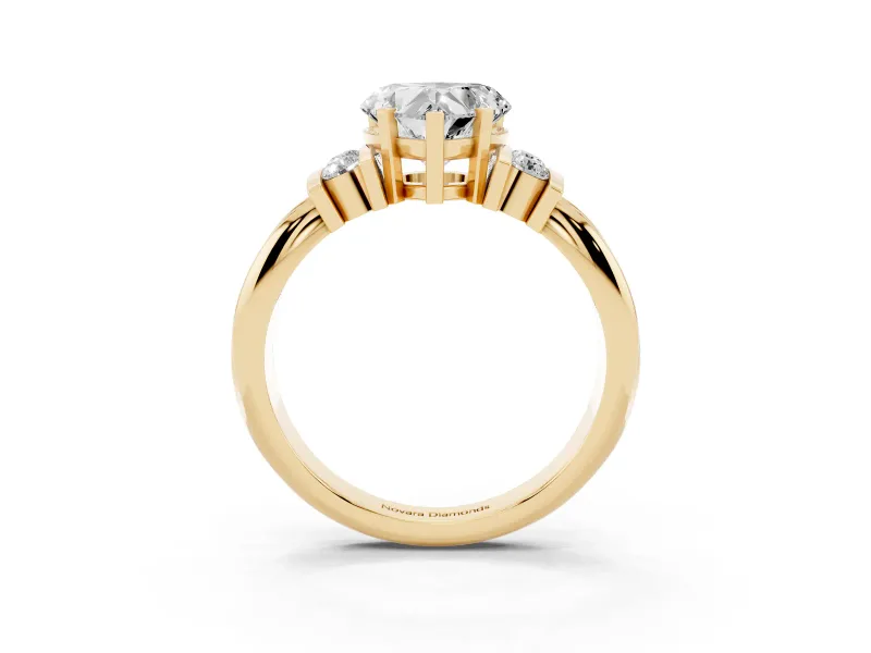 Three-Stone Heart Cut Diamond Channel Set Ring Set in Yellow gold with Bar Prongs