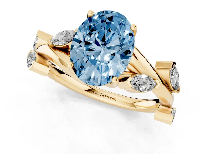 Fancy Blue Oval Cut Diamond Solitaire Ring Set in Yellow gold with Twisted Marquise Accent Band